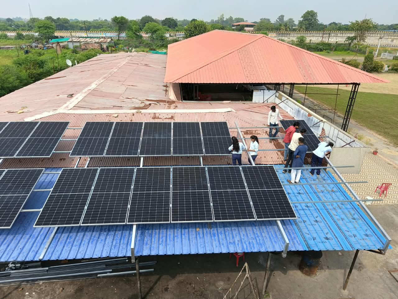 Shaurya Power Solutions team installing solar panels